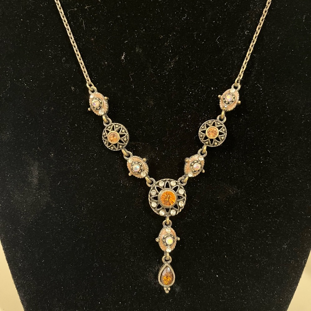 Vintage style necklace with orange center stone.